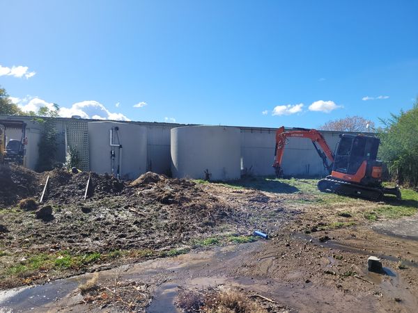 Breaking up old concrete water tanks at Brancott Estate winery, Marlborough