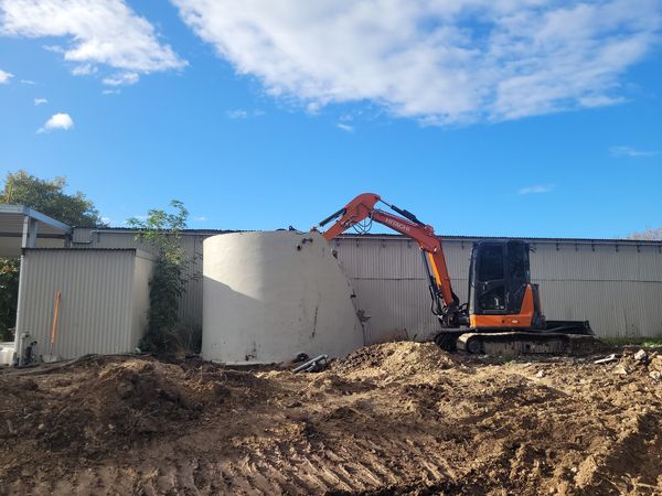 Concrete water tank being broken up at Brancott Estate, Marlborough